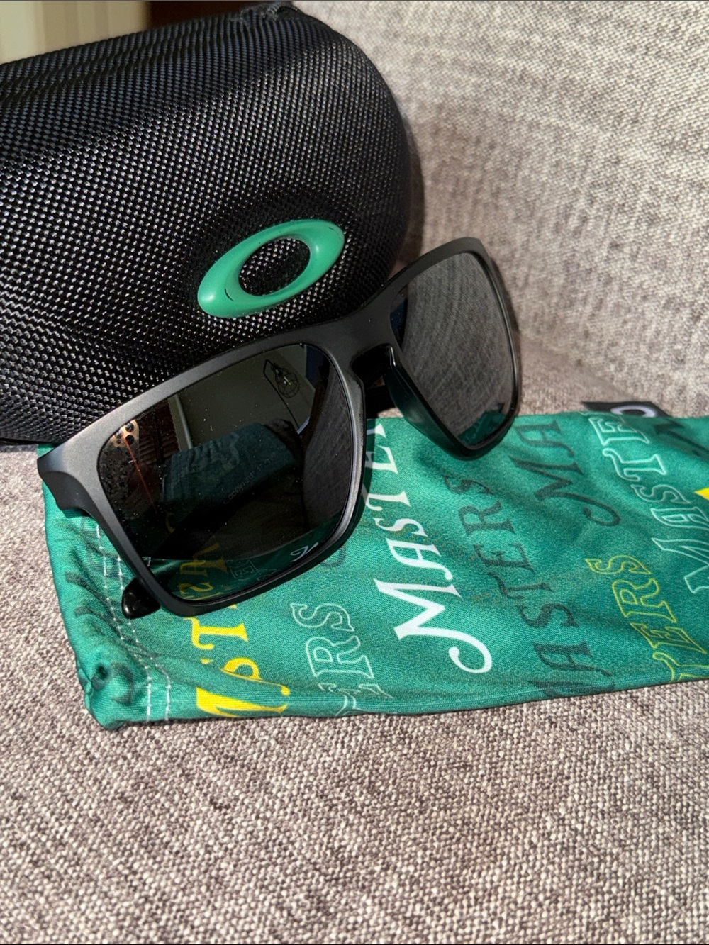 Oakley Black Men's Sunglasses with Green Branded Cleaning Cloth